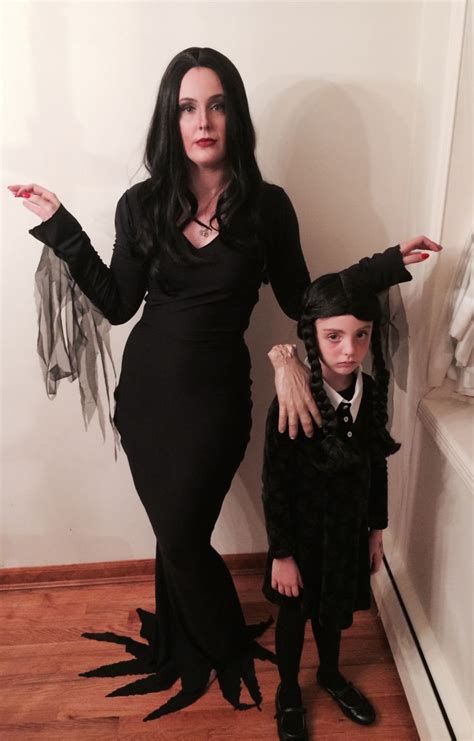 Nothing is more amazing than an upcoming animated movie that is inspired by the old movie of 1991. Morticia and Wednesday Addams with Thing. Halloween 2013. Handmade co… | Daughter halloween ...