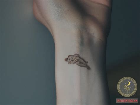 hand tattoo dream meaning what does it signify