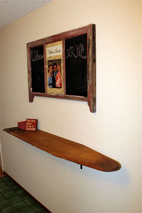 A practical, stable board that'll get the job done and so compact that you'll almost forget it exists!. Shelf is an old wooden ironing board; upcycle, recycle ...
