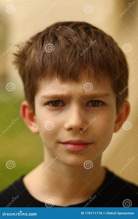 Closeup Portrait Of A Suspicious Caucasian Eighth Year Old Boy Looking