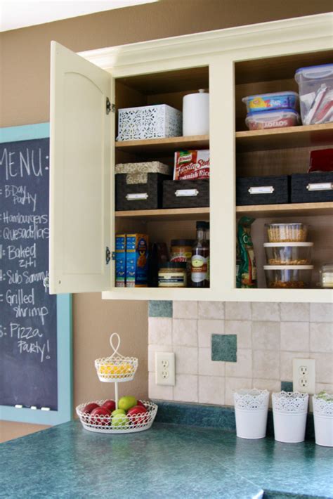 These kitchen cabinets were painted by kim de jong. IHeart Organizing: Kitchen Cabinet Basket Bliss