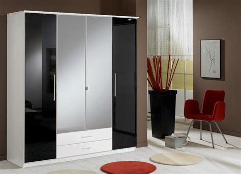 However, the space is tied together by glints of gold accent pieces. Berlin 4 Door Wardrobe German High Gloss Black and White ...