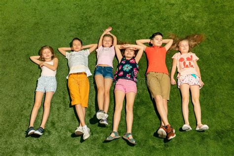 Group Of Happy Children Playing Outdoors Stock Photo Image Of Female