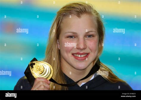 Lithuanias Ruta Meilutyte Presents Her Gold Medal After Winning The