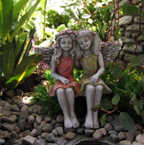 Two Fairies Sitting Down Having A Hug Two Girl Fairies Outdoor Fairy