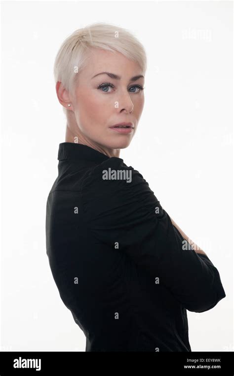 Mature Woman Arms Folded With Short Blonde Hair Stock Photo Alamy