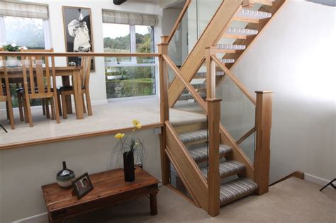 Open Tread Oak Staircase Renovation With Embedded Glass Balustrade