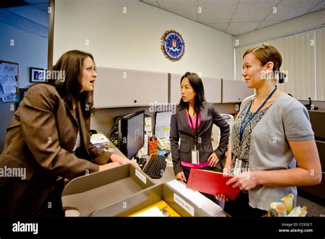 three female fbi agents discuss a case in santa ana ca office note filipino american in