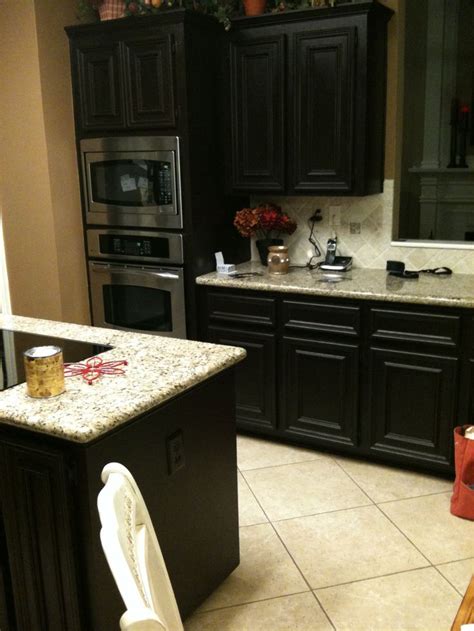Rachelle of originally worn shows you how to stain over an existing finish on cabinetry using general finishes gel stain. diy gel stain kitchen cabinets. Black with the faux ...