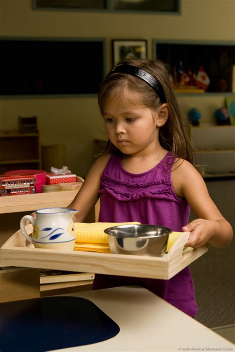 Carrying liquids on a tray - Northwest Montessori Preschool