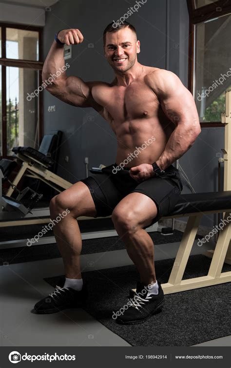 Handsome Young Man Sitting Strong Gym Flexing Muscles Muscular Athletic