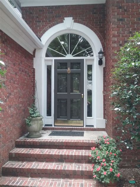 Urbane bronze is a darker gray, that has a slight bronze/brown undertone to it (hence the. Wood storm door painted with Sherwin Williams Urbane ...