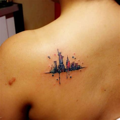 Watercolor Style New York Skyline Tattoo On The Left