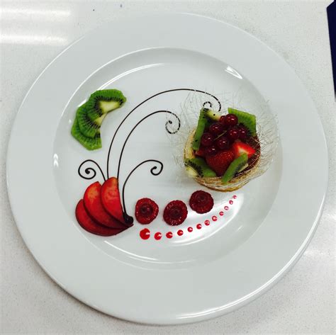 A White Plate Topped With Fruit And Veggies