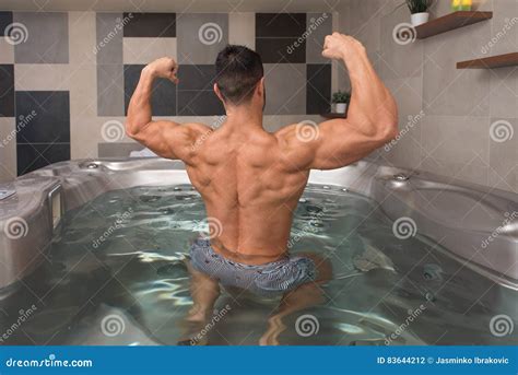 Guy Flexing Muscles In Azure Jacuzzi Stock Photo Image Of Portrait