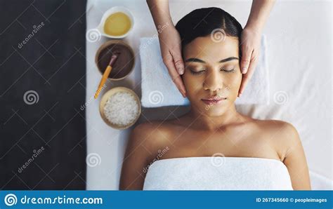 The First Step To A Fresh Start An Attractive Young Woman Getting A Massage At A Spa Stock