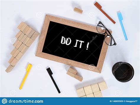 Do It Text On Blackboard With Office Accessories Business Motivation