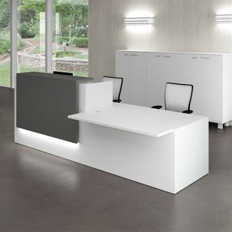 An Office With White And Black Furniture In It
