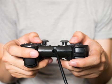 A Young Man Holding Game Controller Playing Video Games Aff