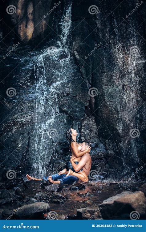 Couple Hugging And Kissing Under Waterfall Stock Image Image
