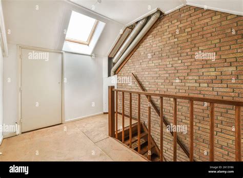 Interior of spacious apartment room on attic of building Stock Photo