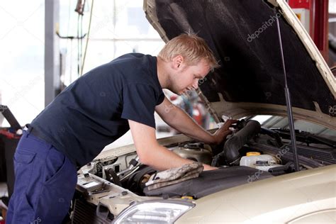 Mechanic Fixing Car Stock Photo By ©simplefoto 6620616