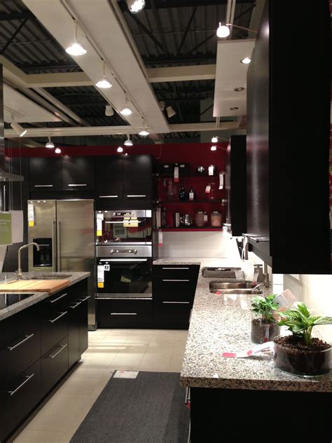 Don't be scared to try this a. Ikea kitchen - dark shelves. open cabinets that are high ...