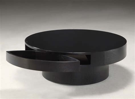 Inspired by classic european designs, this upholstered coffee table is beautifully crafted from solid wood with a tufted, amply padded top. 2020 Popular Black Round Coffee Tables with Storage