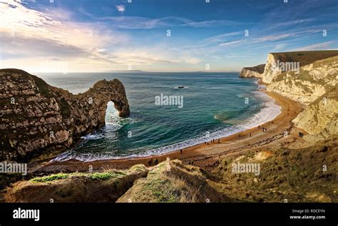 Durdle Door Is A Natural Limestone Arch On The Jurassic Coast Near