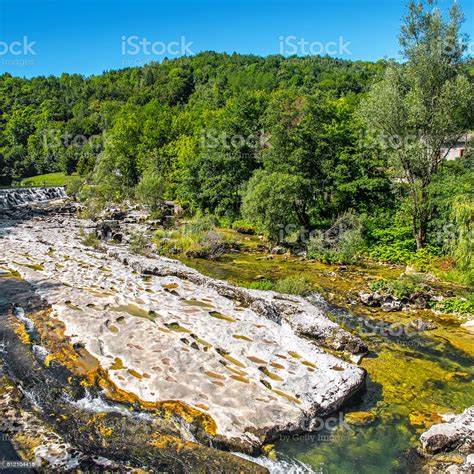 Waterhole From Rock Erosion In Riverbed In Middle Of Forest Stock Photo