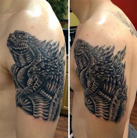 Black And Grey Neo Traditional Tattoo Of Godzilla On Mans Bicep Dragon Tattoo Designs Tattoo