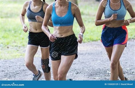 Three Girls Running On A Gravel Path In The Summer Stock Image Image Of People Athletics