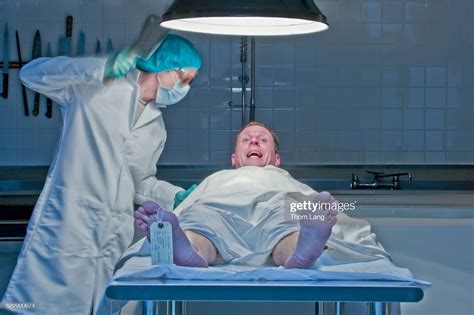 Man Waking Up On Autopsy Table Rwtfstockphotos