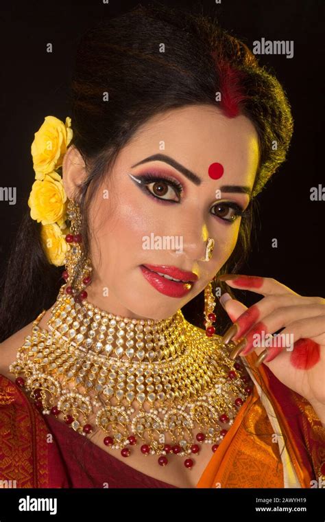 Portrait Of An Young And Beautiful Indian Bengali Brunette Woman In Red