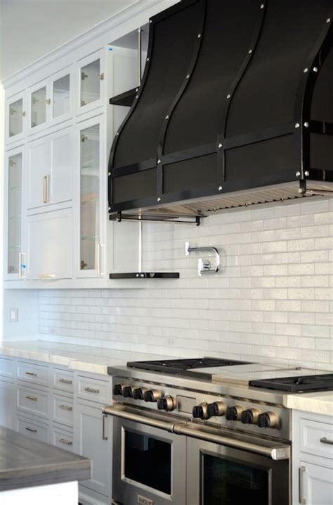Tan works well in this style of kitchen. Black Range Hood - Transitional - kitchen - RT Abbott Construction