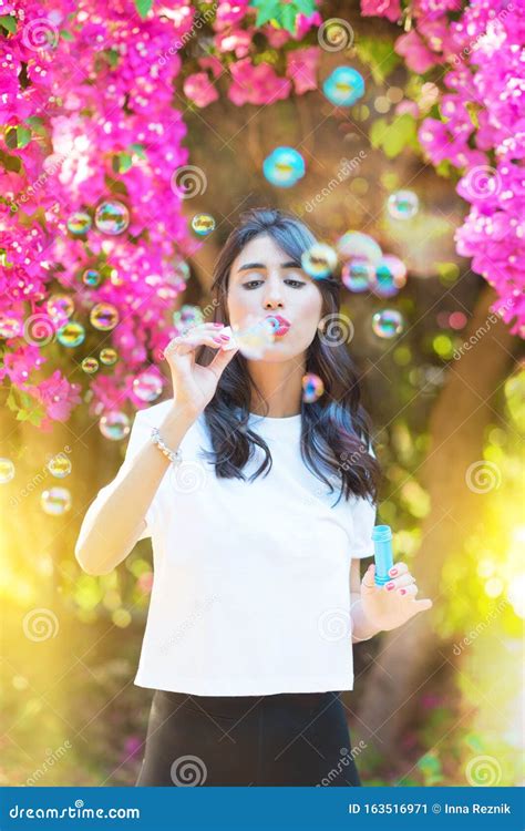 Happy Beautiful Young Woman Blowing Soap Bubbles Outdoor Stock Image Image Of Colorful