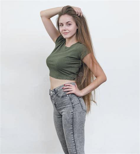 Nice Girl With Beautiful Breasts In A Green T Shirt Posing On Ca Stock