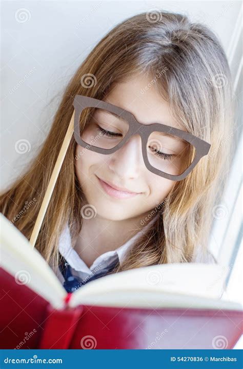 Cute Schoolgirl In Glasses Holding A Book Stock Photo Image 54270836