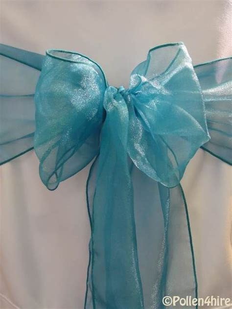 Using organza will create a romantic. teal (2) | Wedding chair sashes, Organza, Teal