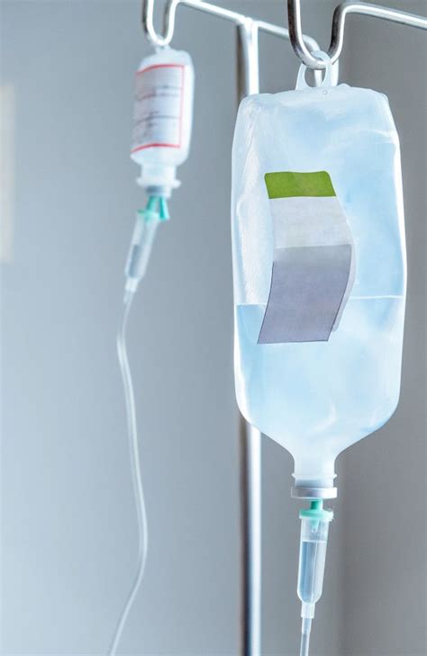 Close Up Of Iv Saline Solution Drip For Patient In Hospital Saline