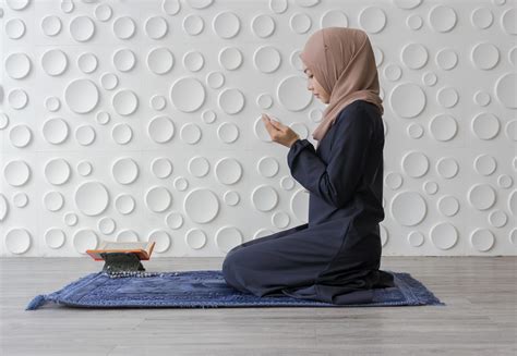 Muslim Woman Kneeling In Prayer 1226747 Stock Photo At Vecteezy