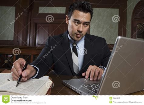 Male Advocate Using Laptop stock image. Image of concentrating - 29663017