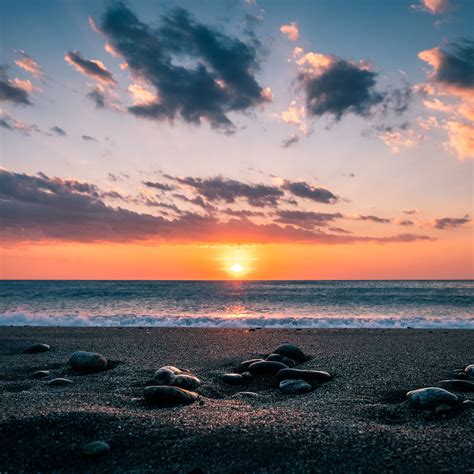 Download Wallpaper 2780x2780 Sea Stones Shore Horizon Sunset Sky