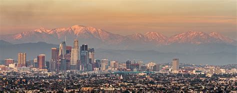 Snowy Mountains And Downtown Los Angeles Stock Photo