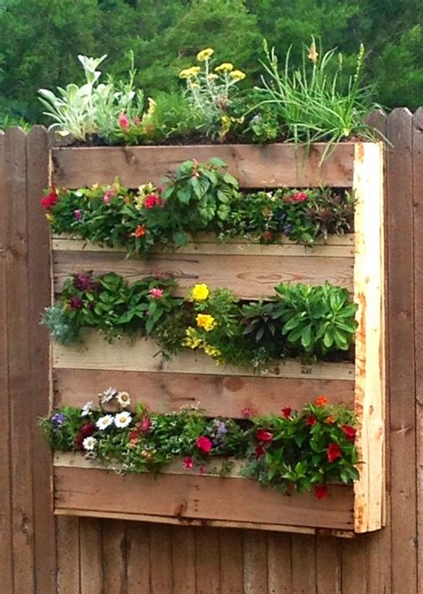 This typically falls somewhere between march and may, depending on planting intensively in a raised bed garden minimizes moisture loss. Vertical Pallet Flower Box Garden. Added landscape fabric ...