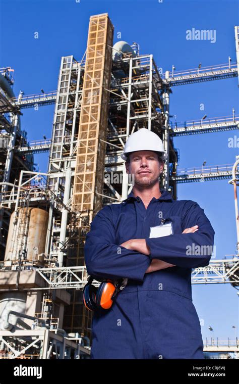 Worker Standing At Oil Refinery Stock Photo Alamy