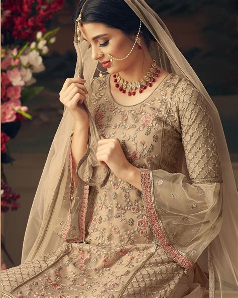 Beige Color Net Embroidered Heavy Sharara Un Stitched Pakistani Suit