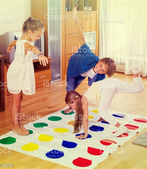 Children Playing Twister At Home Stock Photo Download Image Now