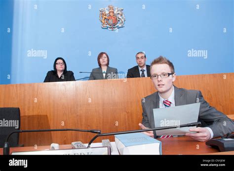 Clerk of the Court sits in front of Magistrates' Stock Photo, Royalty
