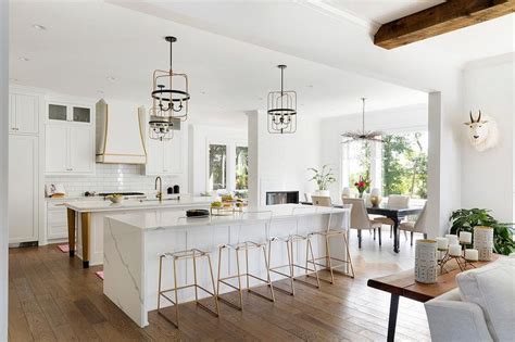 The wood waterfall edge adds character and interest to this transitional white kitchen, which blends traditional and contemporary styles. Marble Look Waterfall Island Countertop - Transitional ...